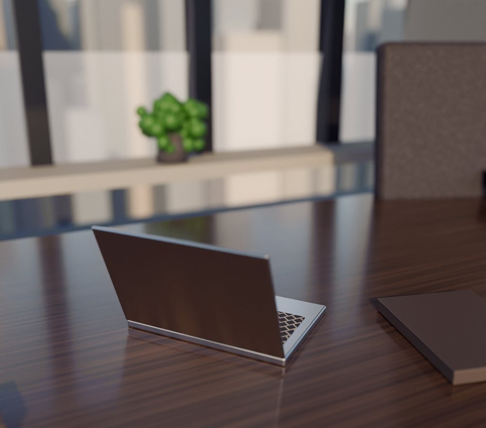 Meja kerja dengan laptop di kantor bertembok kaca menghadap kota